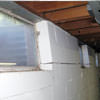 A foundation showing severe inward buckling along the windows in a Johnstown home.