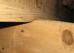 A failing girder showing signs of compression damage in a Western PA, Northern West Virginia, and Eastern Ohio home