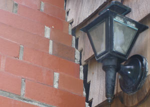 A tilting chimney in Weirton showing serious foundation damage.