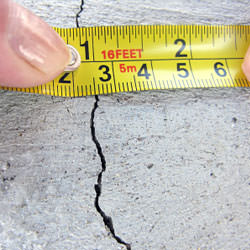 A crack in a poured concrete wall that's showing a normal crack during curing in Washington