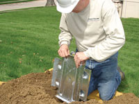 Fastening an earth anchor for a severely bowing wall in Gibsonia.