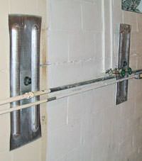 A foundation wall anchor system used to repair a basement wall in White