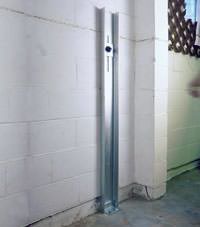 A failing foundation wall repaired with a foundation wall channel anchor system in a Morgantown home.