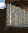 I-beam foundation wall supports installed in a New Kensington basement.