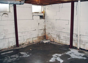 A failed, rusty i-beam foundation wall system installed in South Park.
