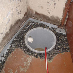 Installing a sump in a sump pump liner in a McKeesport home