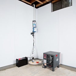 Sump pump system, dehumidifier, and basement wall panels installed during a sump pump installation in West Mifflin